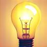 Icon of a lightbulb with gears, symbolizing ideas and suggestions