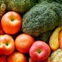 A bounty of fresh, seasonal, organic produce from a local Boulder farmer's market, arranged artfully, conveying freshness and local sourcing.