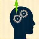 Stylized icon of a head with gears and a green growth arrow, representing improved focus and creativity.